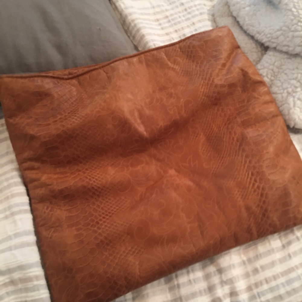 Beautiful brown leather clutch.
